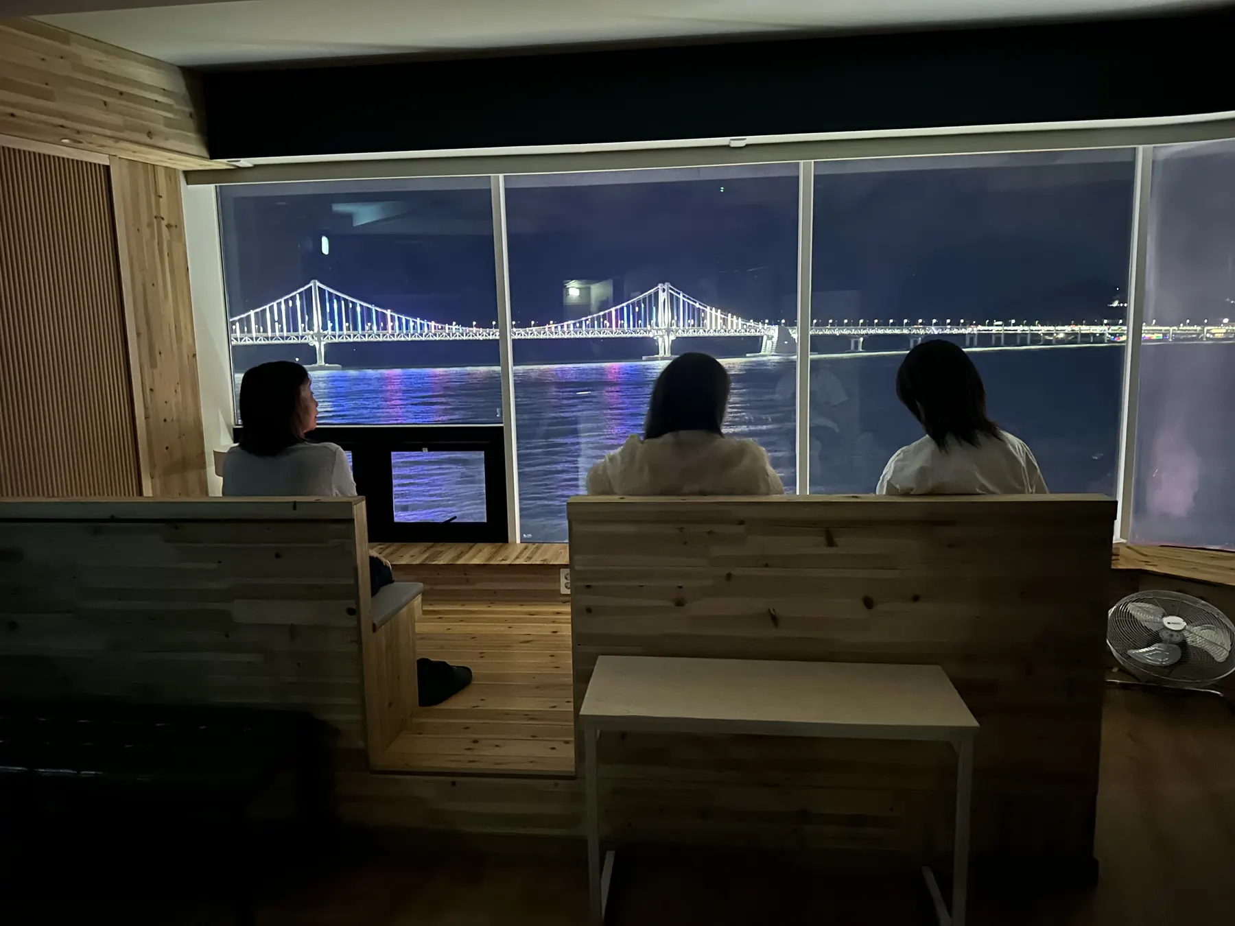 guests enjoying the night view at Prada Spa Gwangalli, Busan